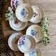 Set of 8 mismatched vintage soup plates