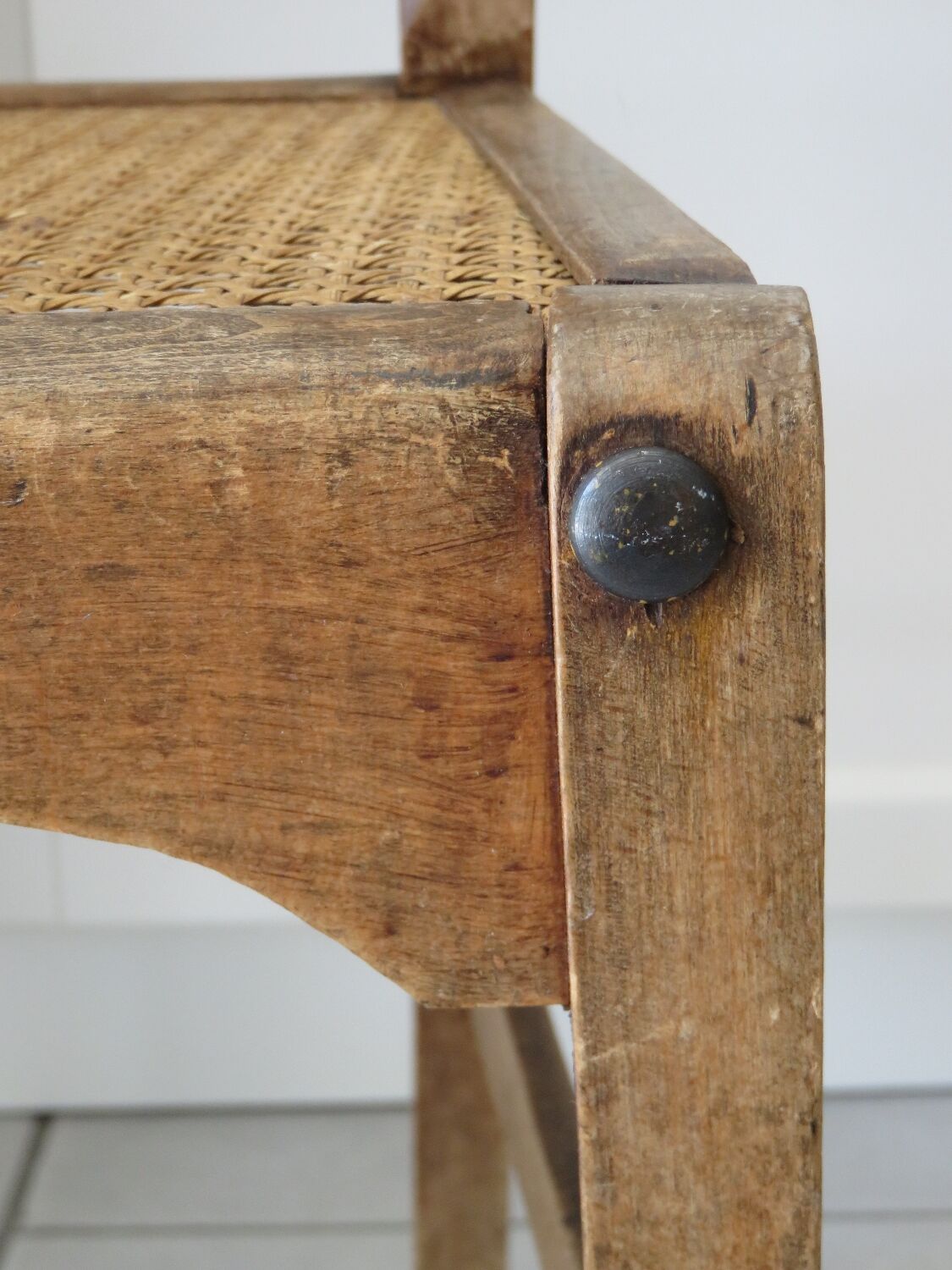 Antique solid wood chair with caning, country house style.