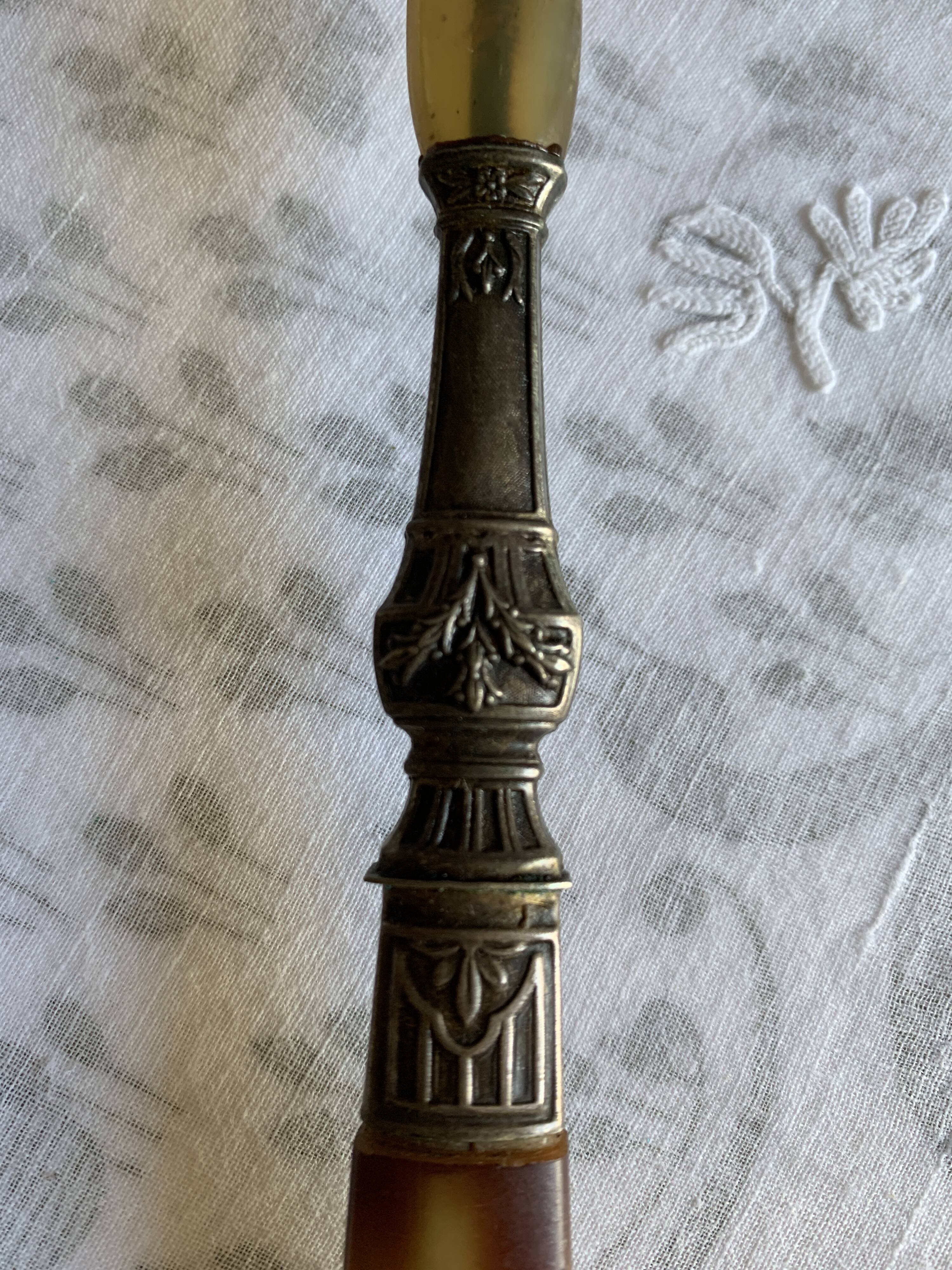 Horn and metal salad servers from the 1920s