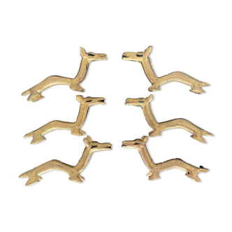 6 brass dromedary-shaped knife holders