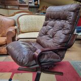 Scandinavian tilting and rotating armchair