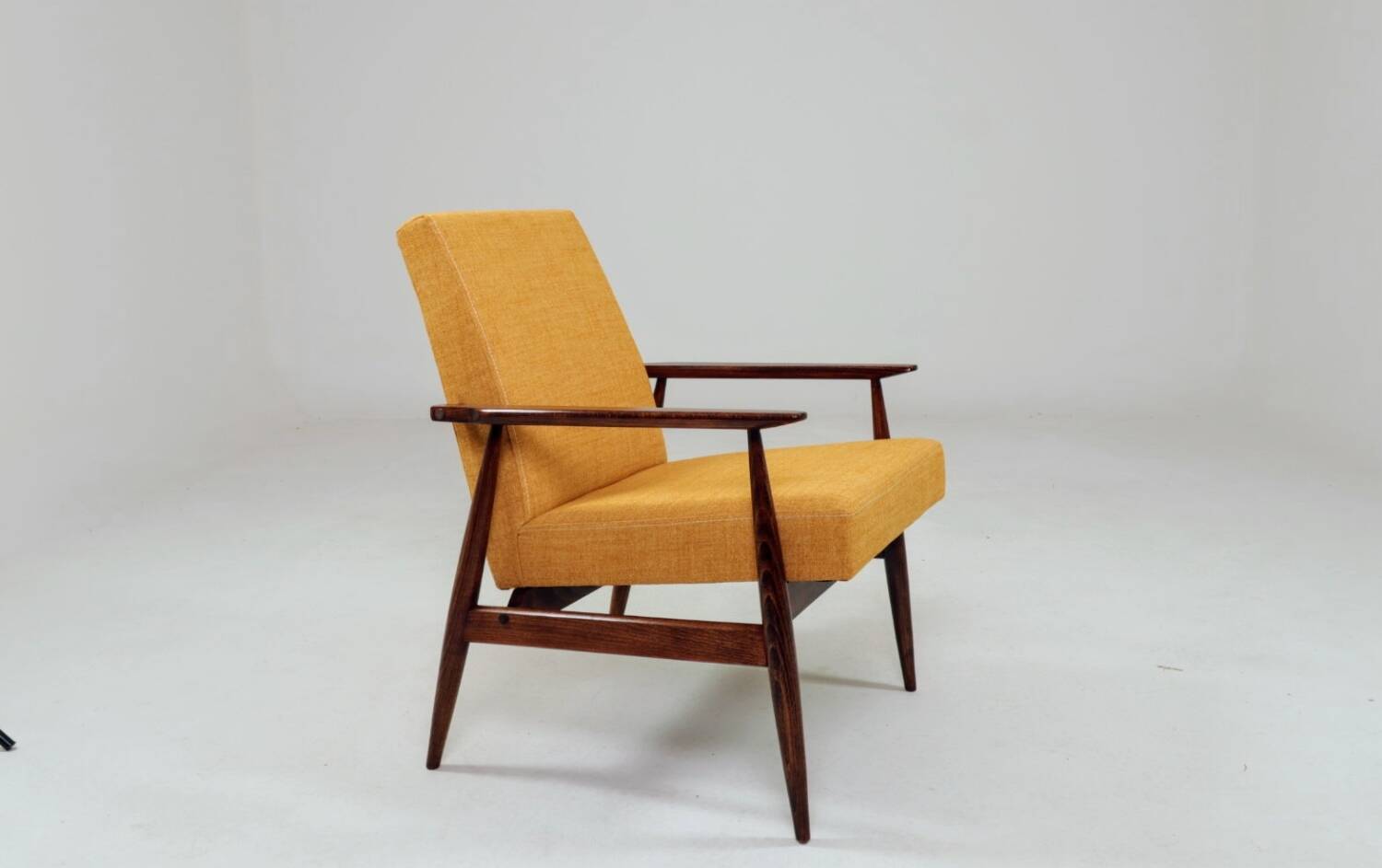 Vintage amber armchair Hermes designed by H. Lis