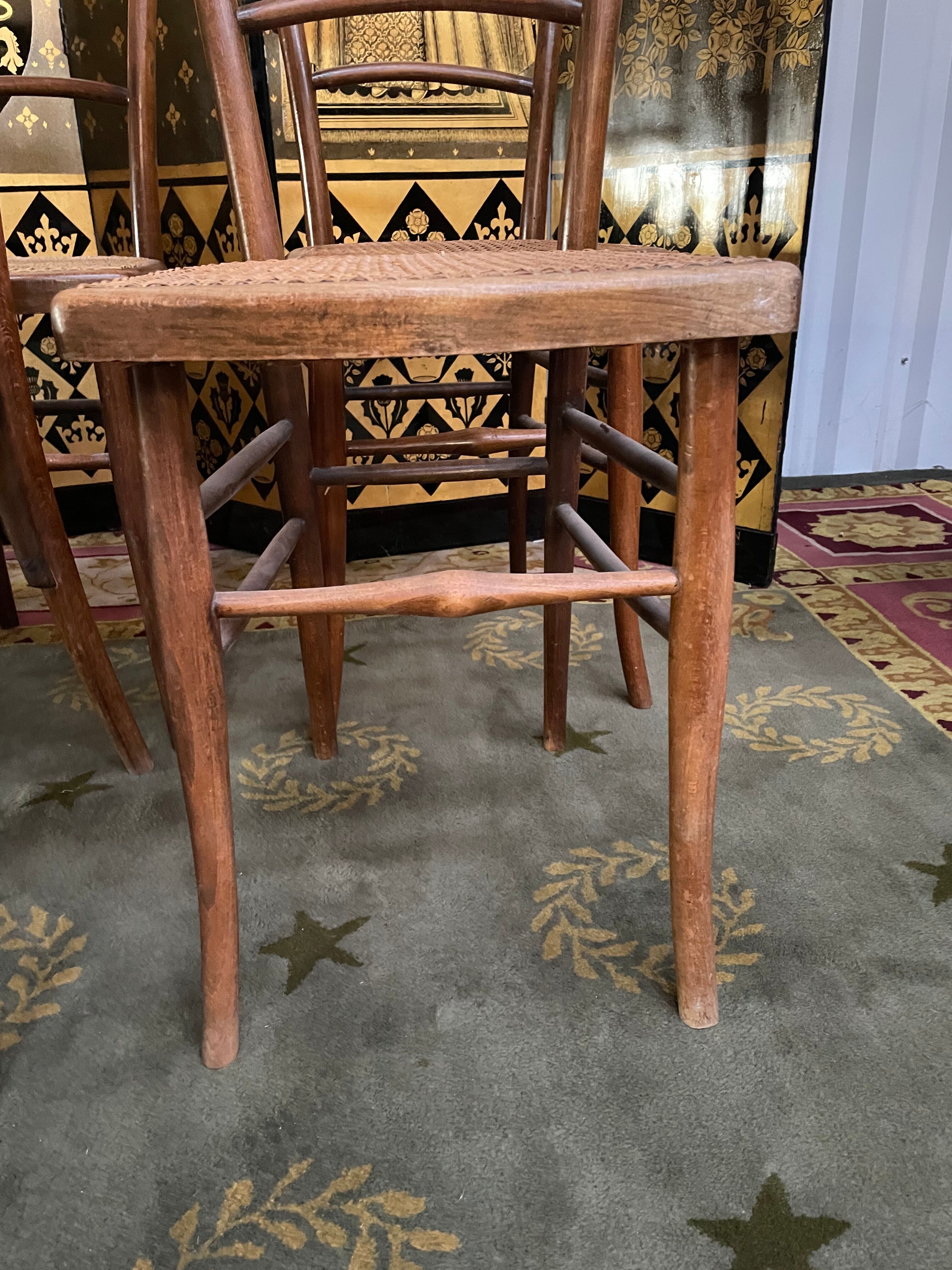 Suite of 10 bistro chairs in cannage