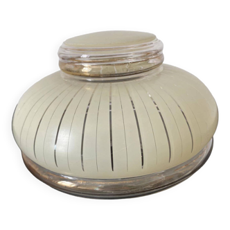 Glass globe with vanilla-colored striped patterns and gold edging