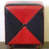 Mid-century ottoman stool in red and black faux leather with wooden legs.