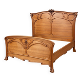 Double bed from the Art Nouveau period – Carved mahogany – Relief flowers