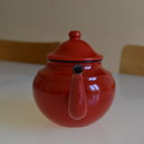Vintage tea in red and black enamelled sheet