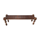 Bench with slats and feet of charpoy beds in teak