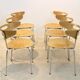 Thonet dining chairs stacked in chrome and beech