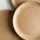 Set of 4 vintage speckled stoneware plates