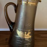 Vintage smoked glass carafe with gold from the 50s/60s, featuring a marine and water skiing design.