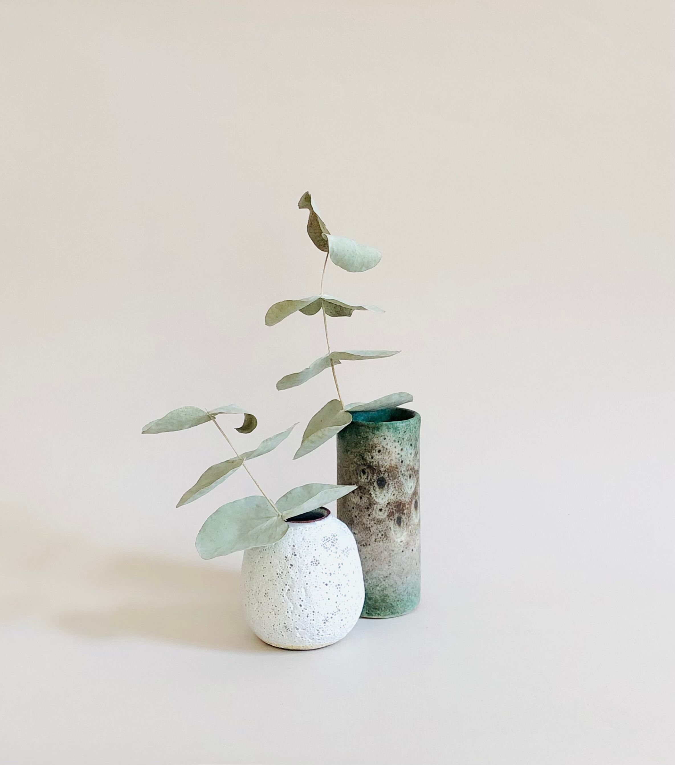 Duo of small sandstone vases