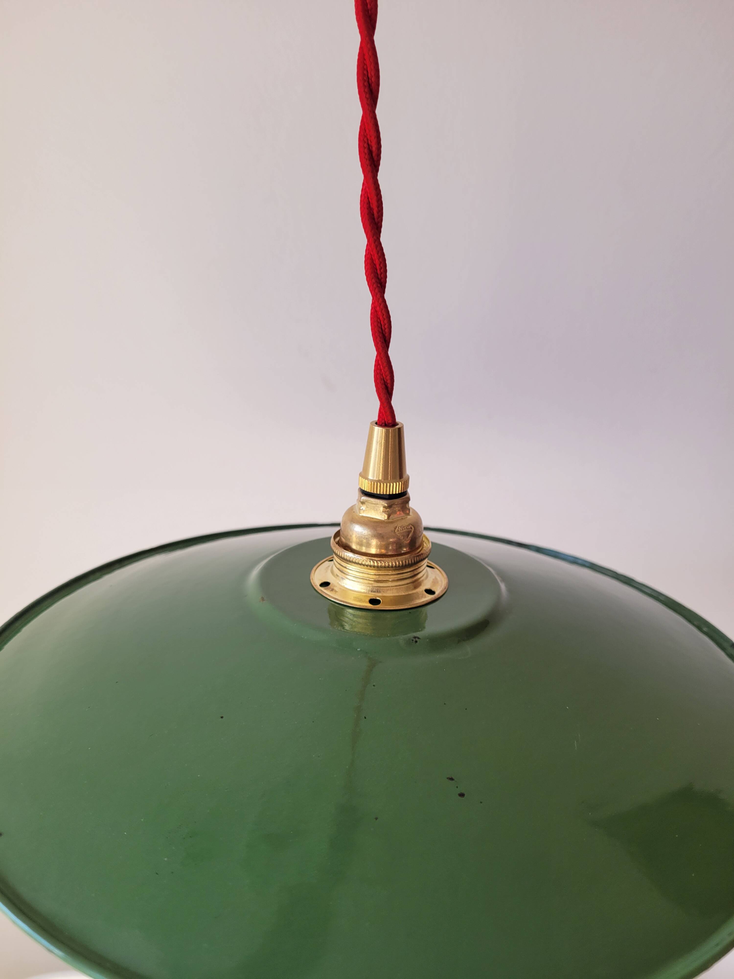 Trio of enameled sheet metal pendant lights