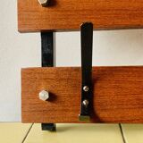 Vintage wall-mounted coat rack in wood and black metal