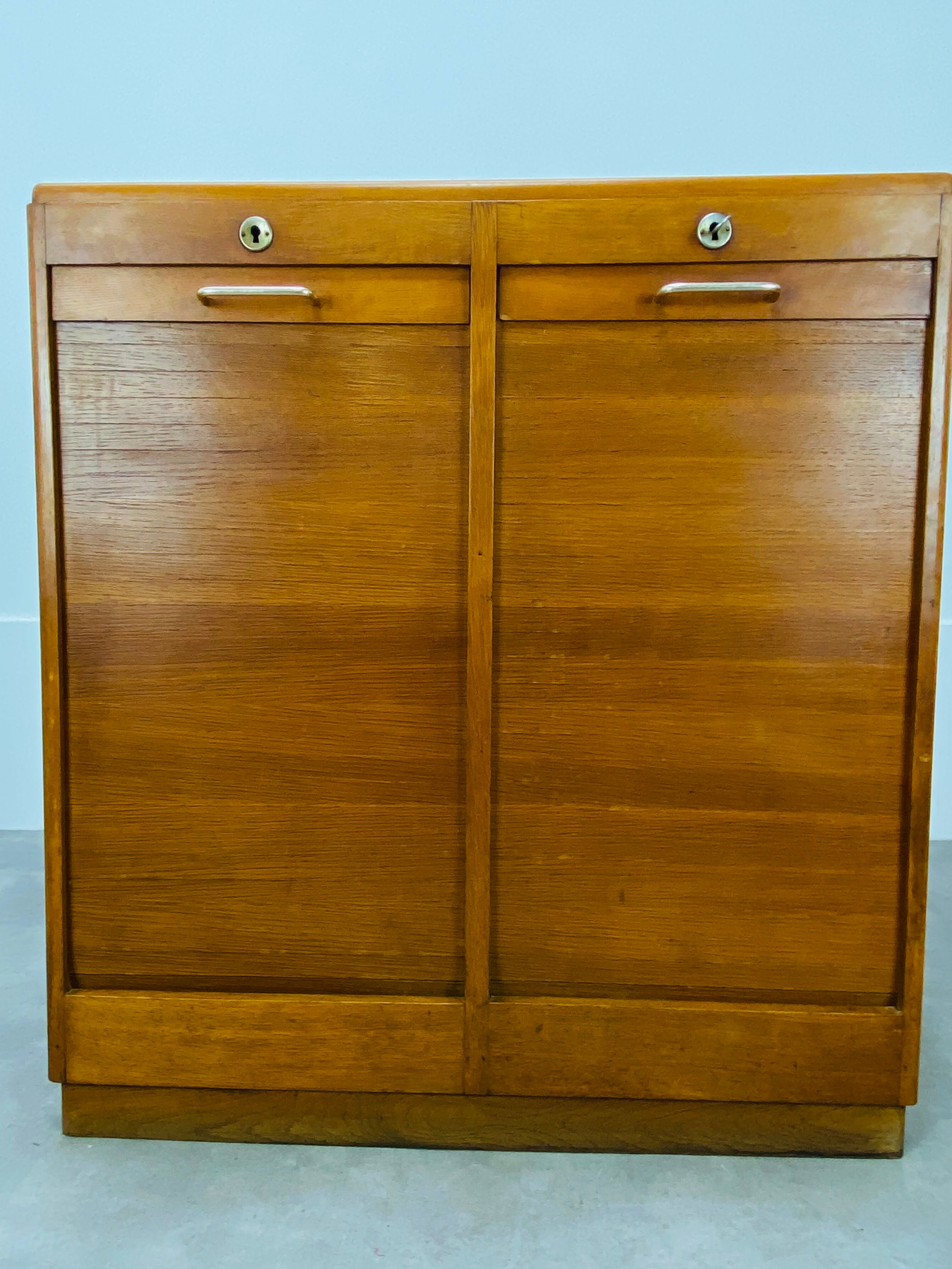 Double curtain binder cabinet