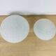 Pair of speckled glass ball wall lights from Vianne, half sphere