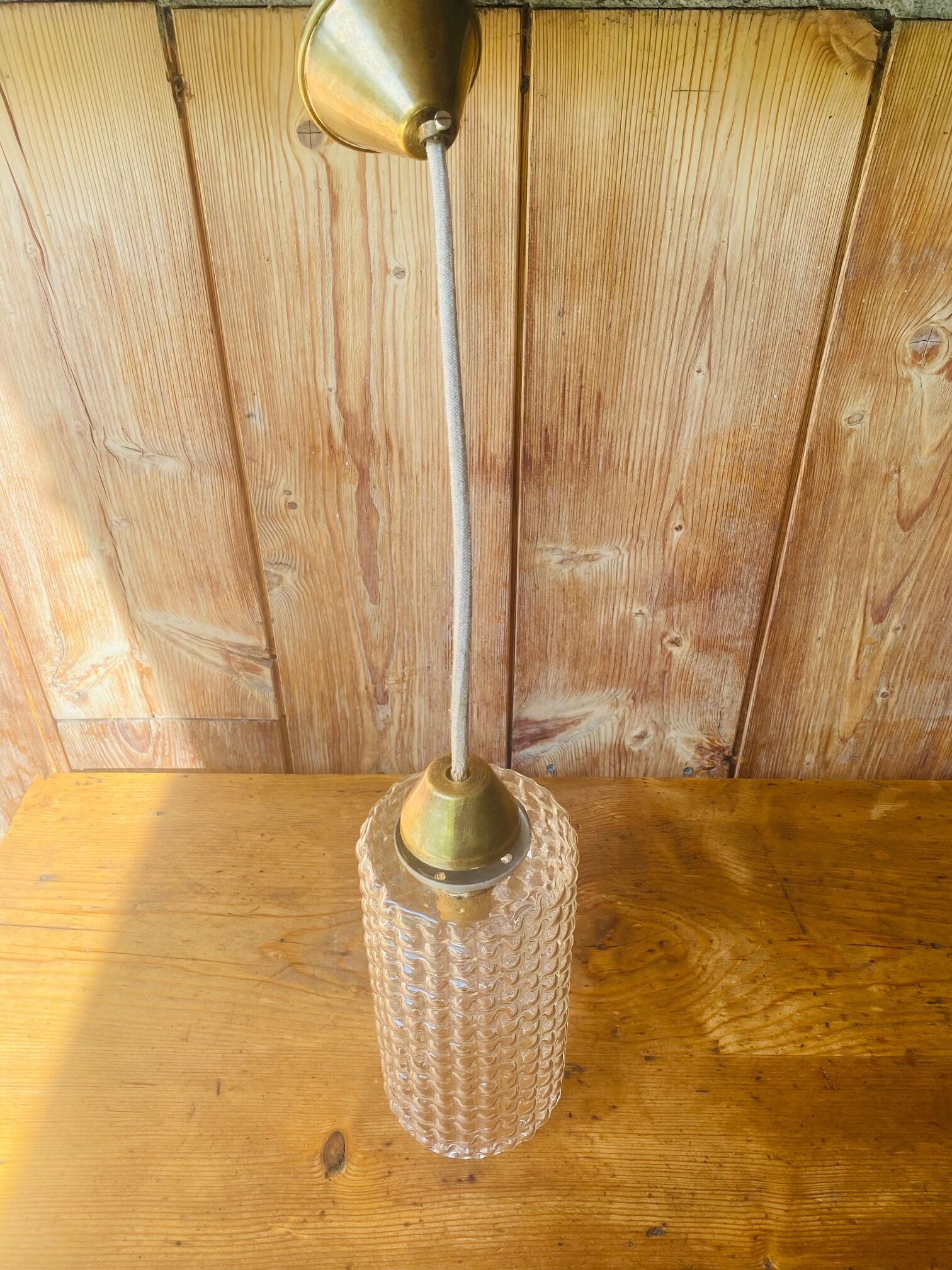 Glass and brass suspension.