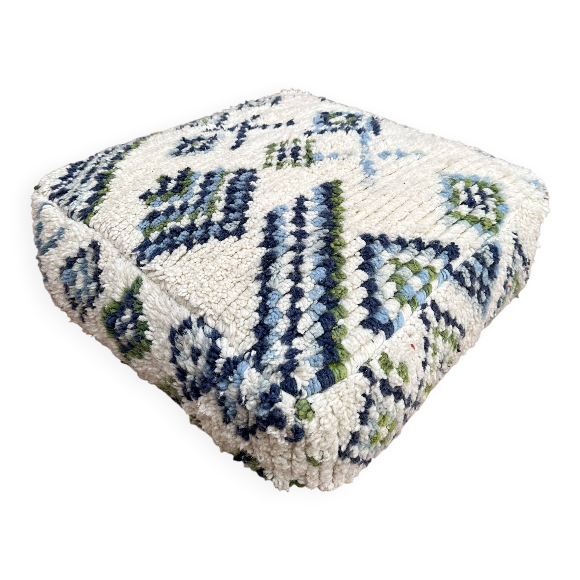 Berber floor pouf: Handwoven Moroccan wool cushion.