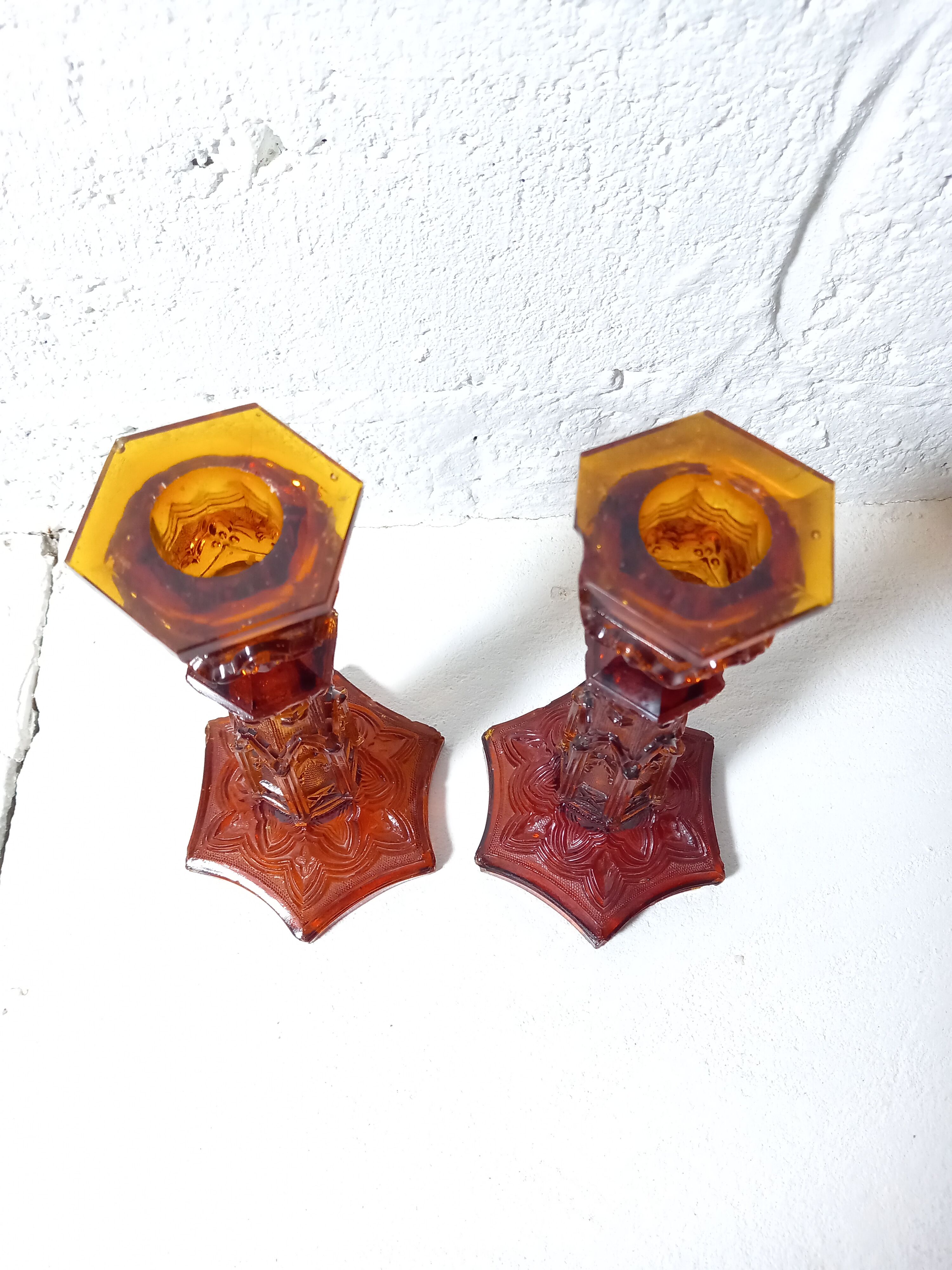 Pair of amber glass torches decorated with gothic motifs