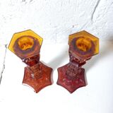 Pair of amber glass torches decorated with gothic motifs