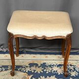Small Louis XV style bench with curved cabriole legs.