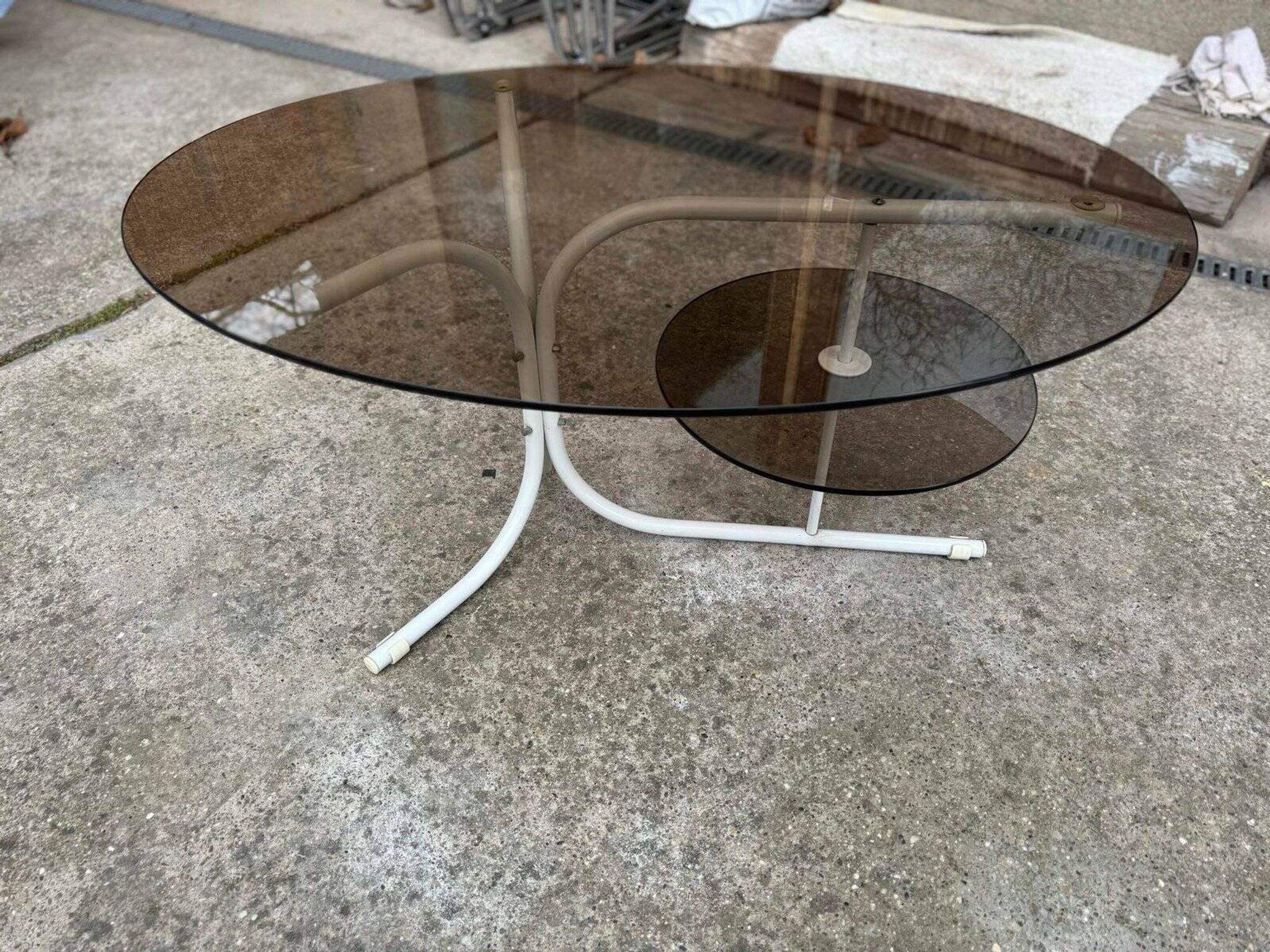 Coffee oval table with metal legs and smoky glass top, 1990s