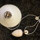 Suspension rises and falls with counterweight in porcelain and opaline