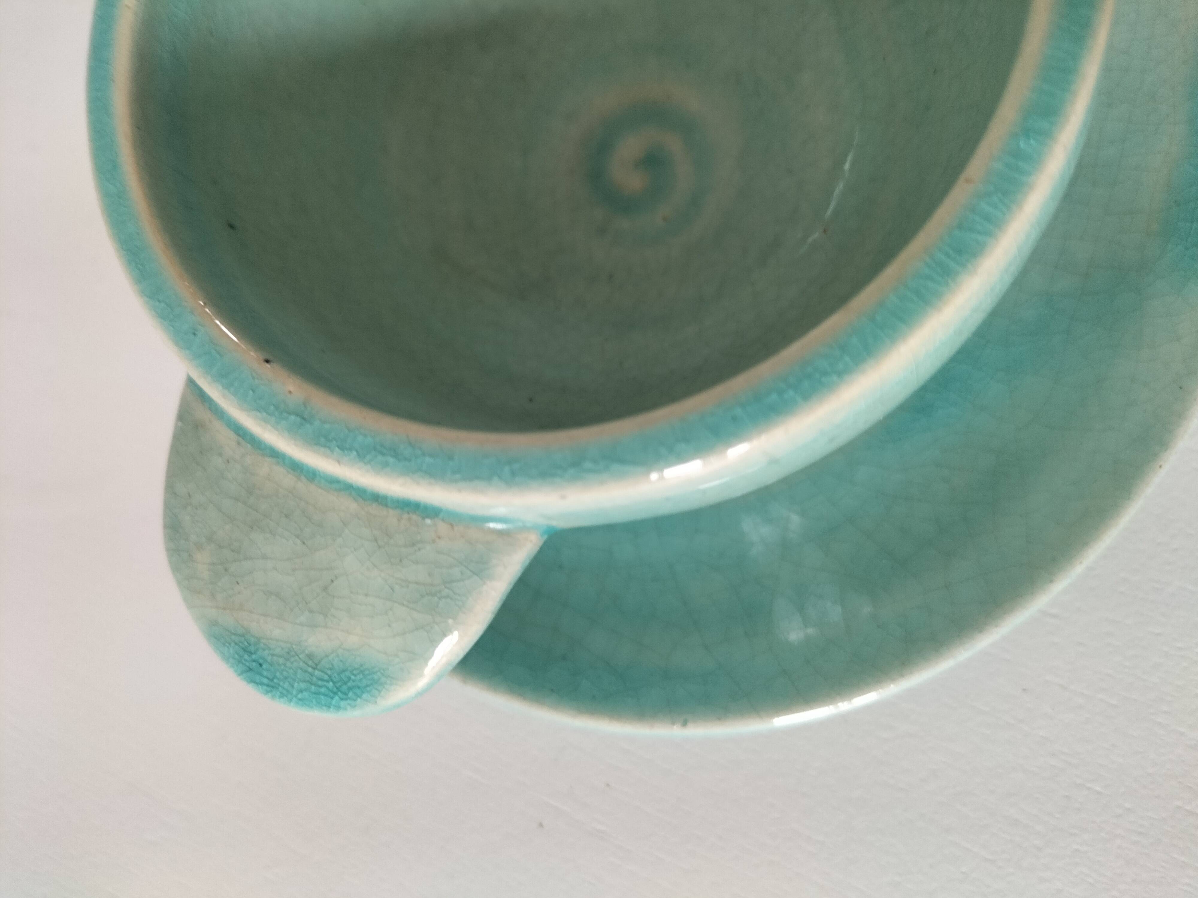 Earthenware bowl and saucer in glazed water green ceramic.