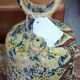 polychrome floral-decorated jug in glazed ceramic