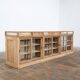 Old glass-fronted pine trade counter - early 20th century