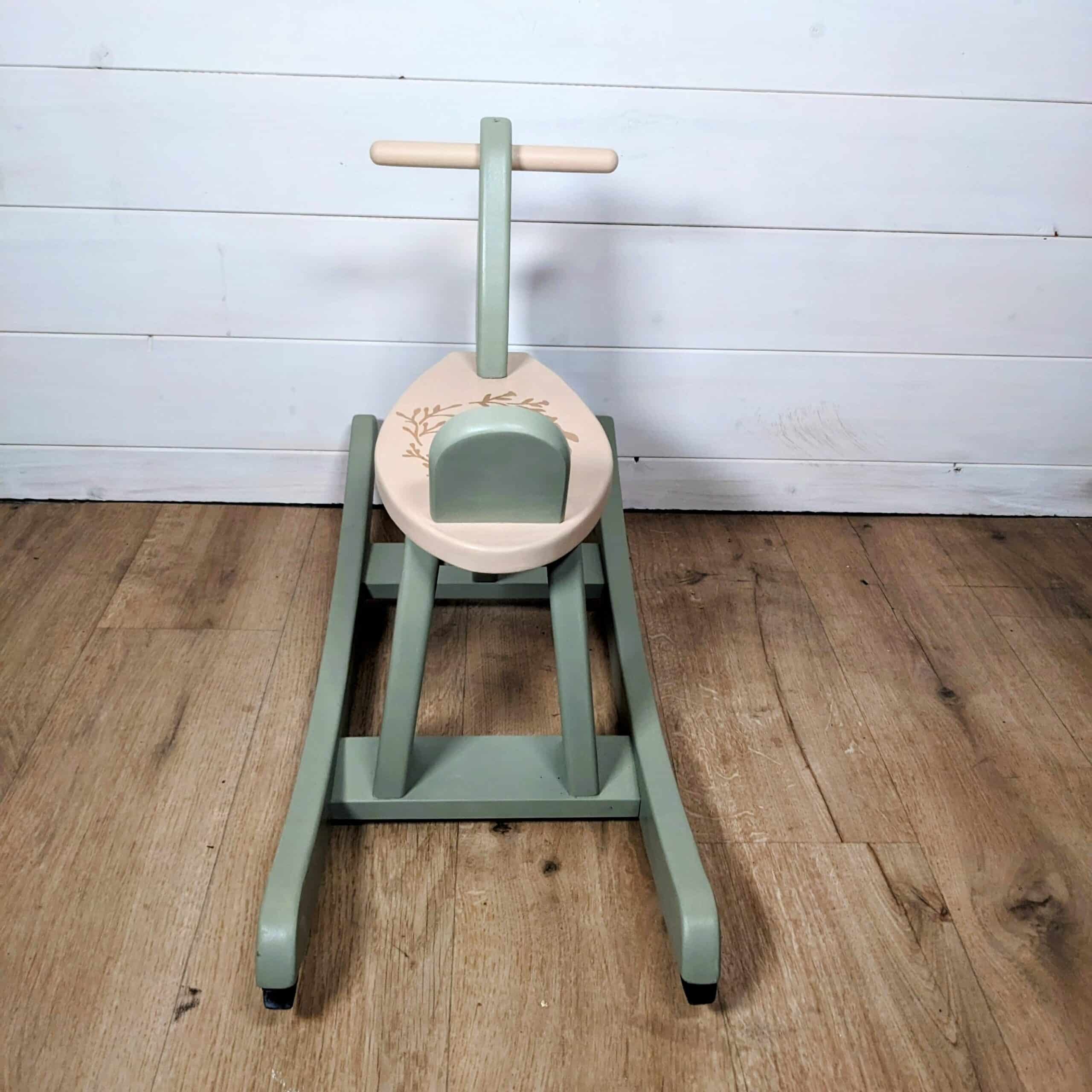 Green and beige wooden rocking horse