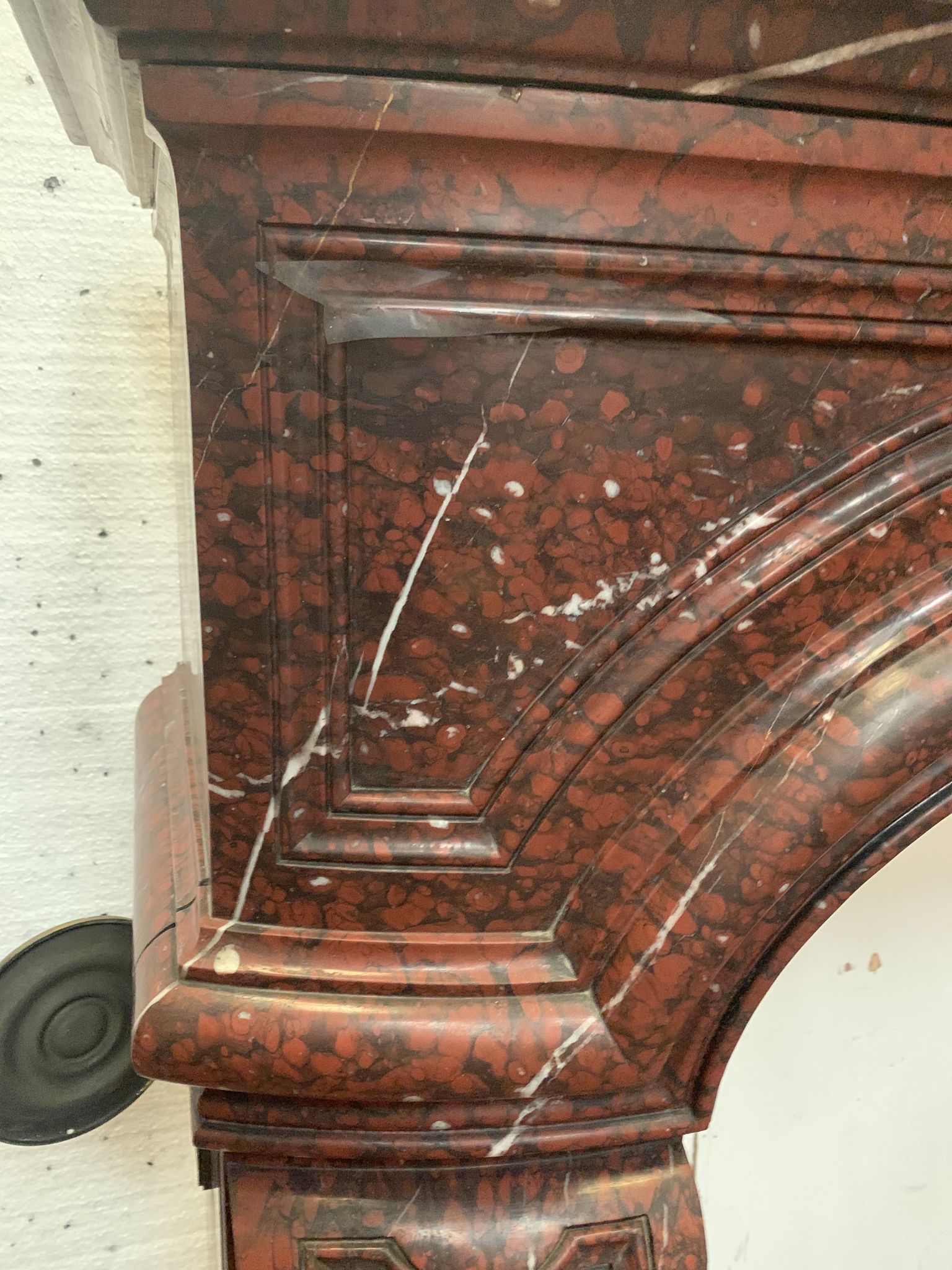 Pair of Louis XIV style fireplaces in red cherry marble. XIX century.