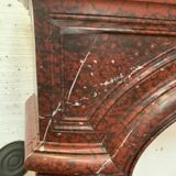 Pair of Louis XIV style fireplaces in red cherry marble. XIX century.