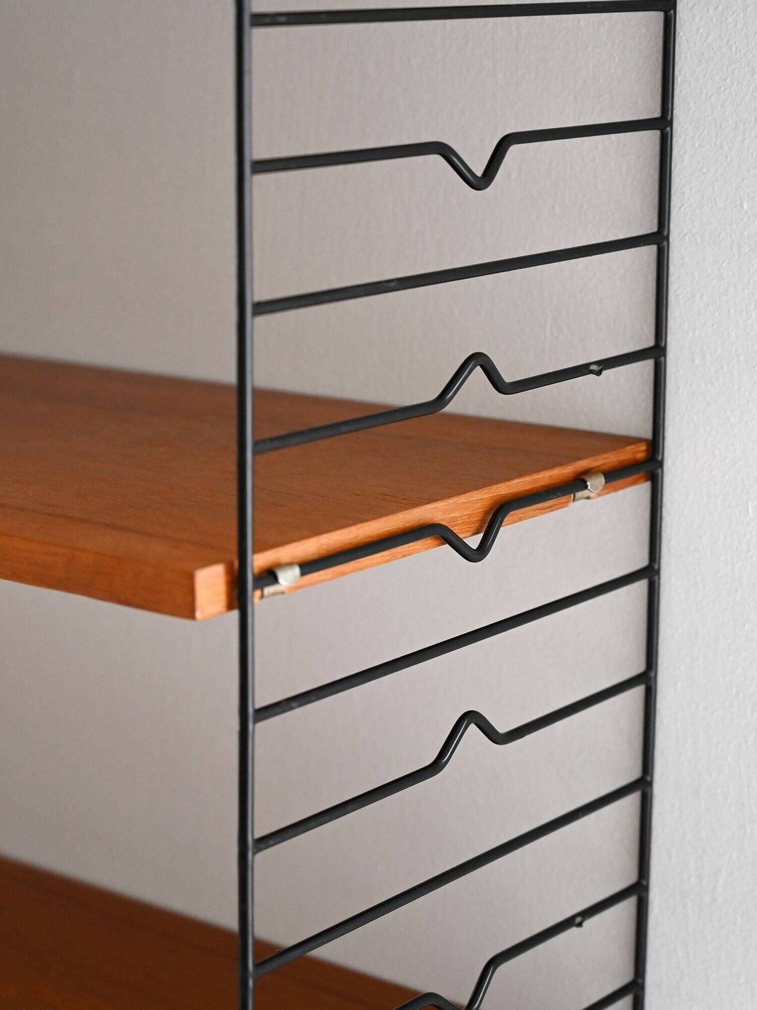 Scandinavian Hylla teak wall shelf with brass label