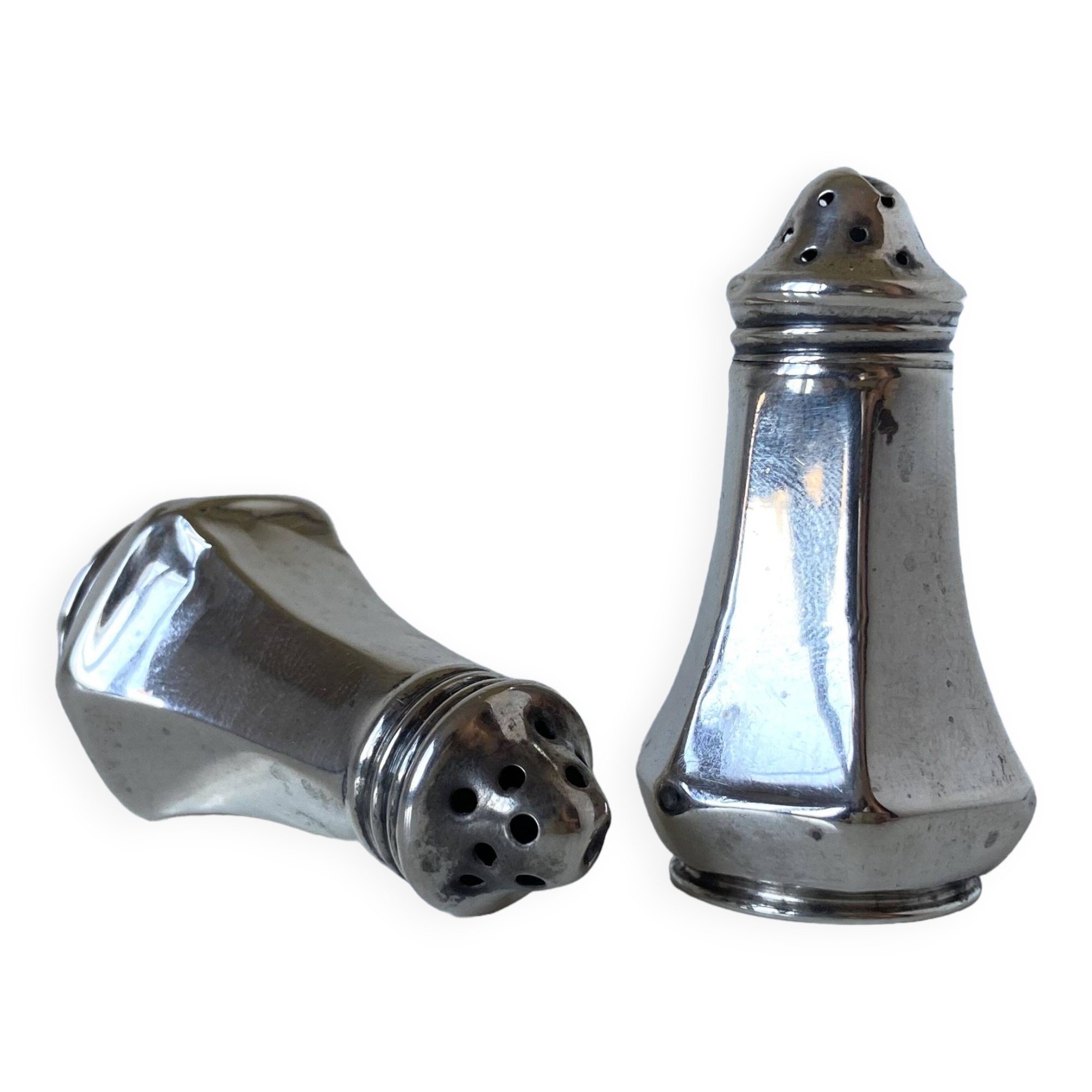 Antique salt and pepper shakers in solid English silver