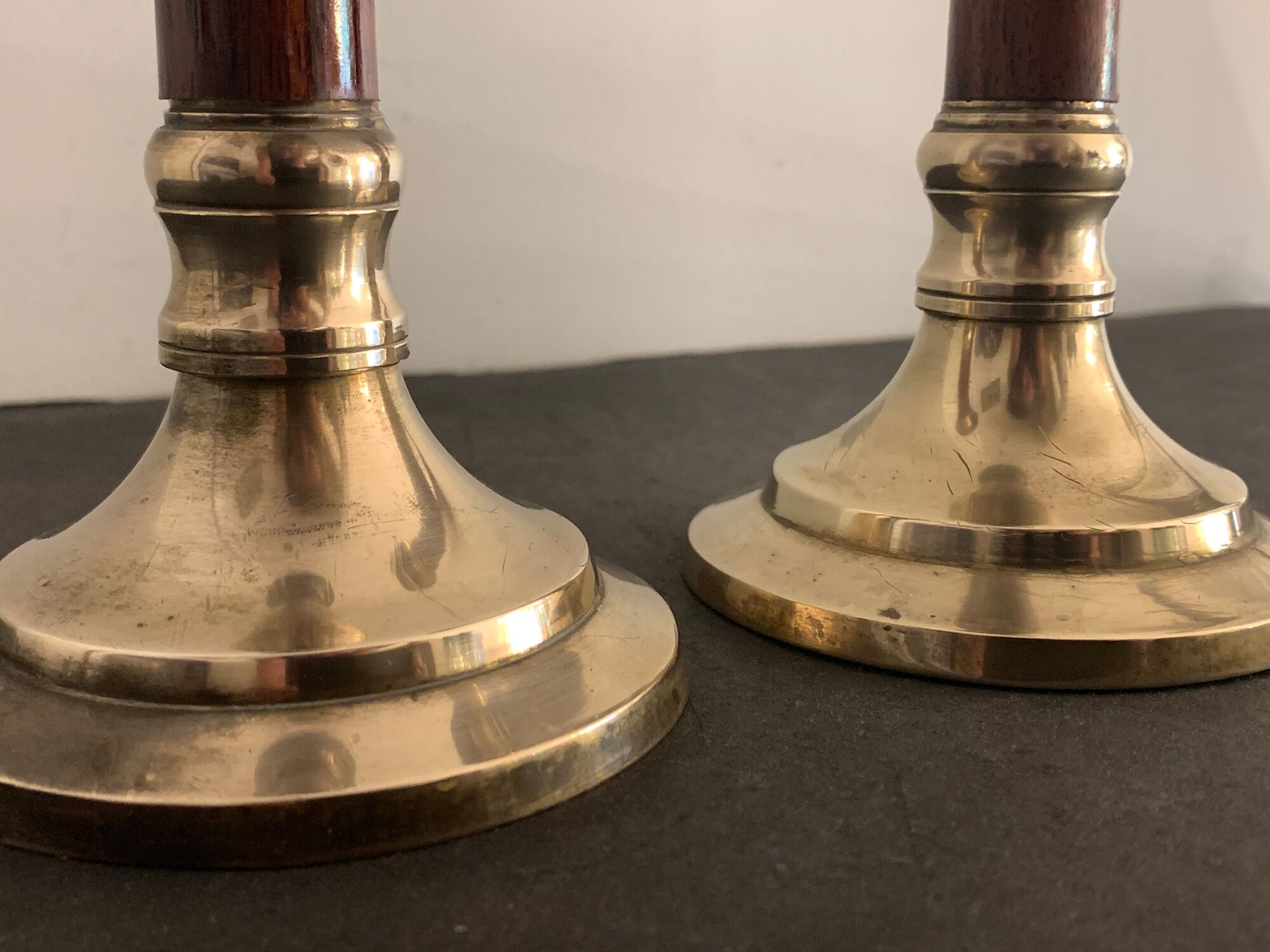 Pair of brass and mahogany wood candle holders