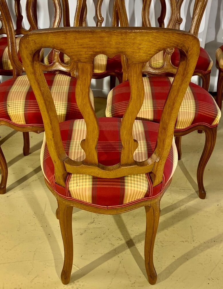 12 chairs in oak, carved wood with fleurette decorations, fabric seat
