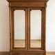 Antique wardrobe with 2 mirror doors in polished wood.