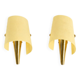 A pair of exceptional Mid-Century brass wall lamps with fiberglass shades