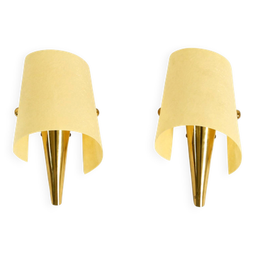 A pair of exceptional Mid-Century brass wall lamps with fiberglass shades