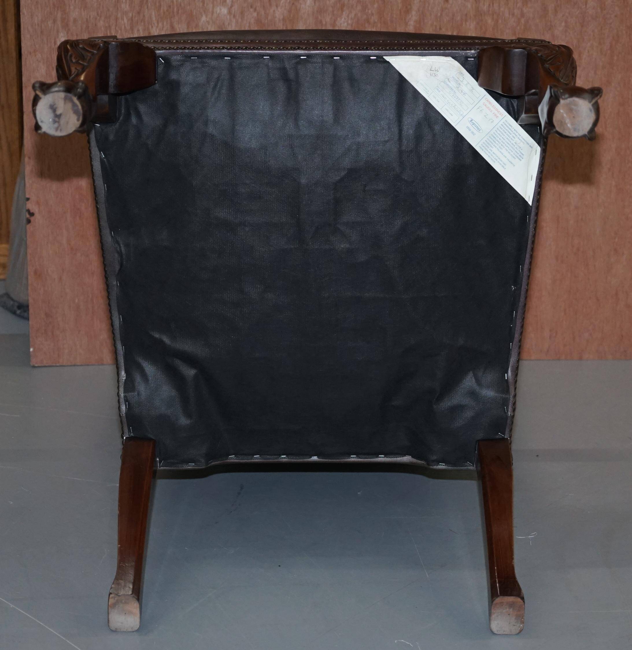 Gainsborough armchair George II leather Chesterfield hand-carved with claw and ball feet.