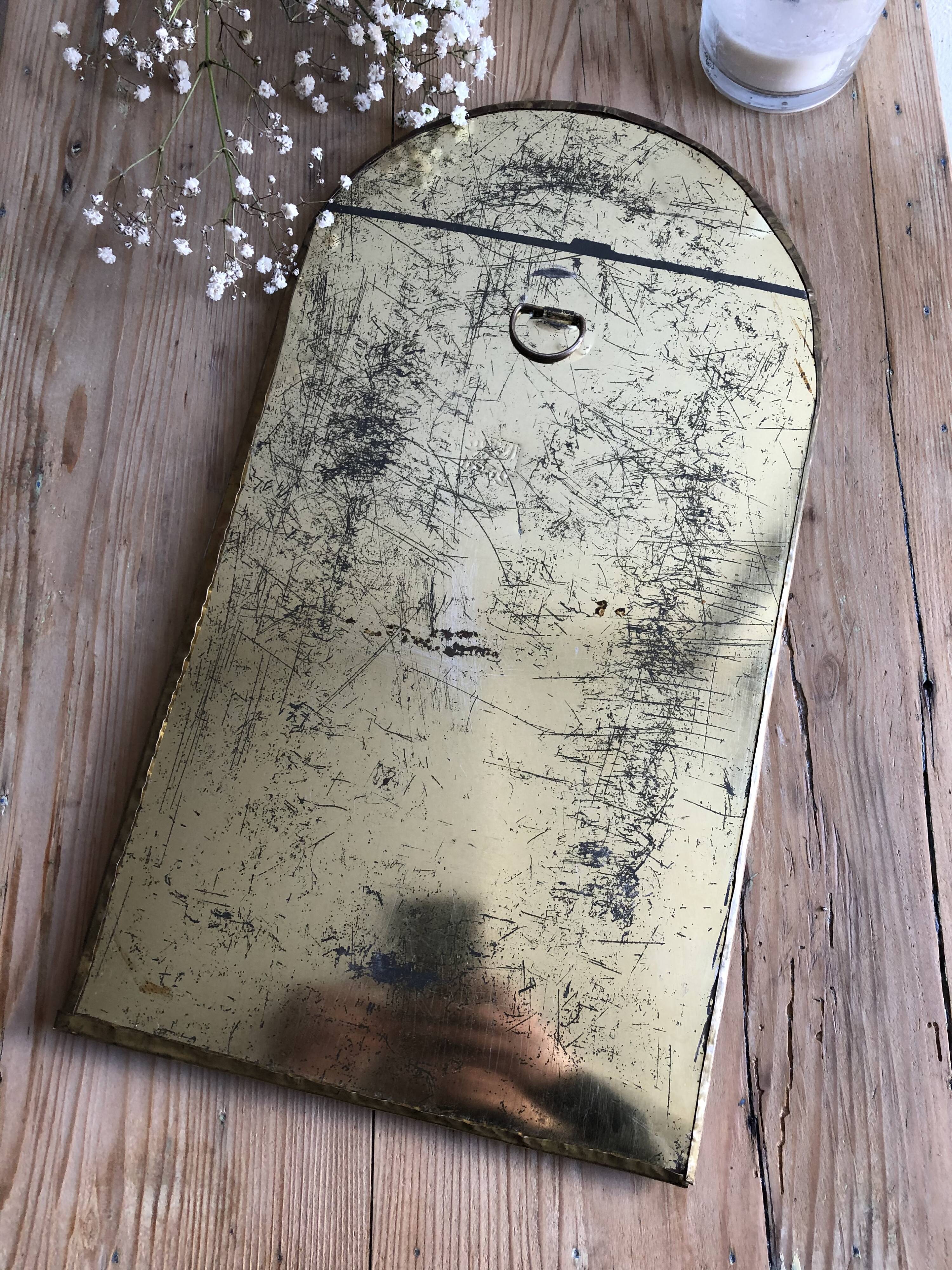 Half moon brass mirror