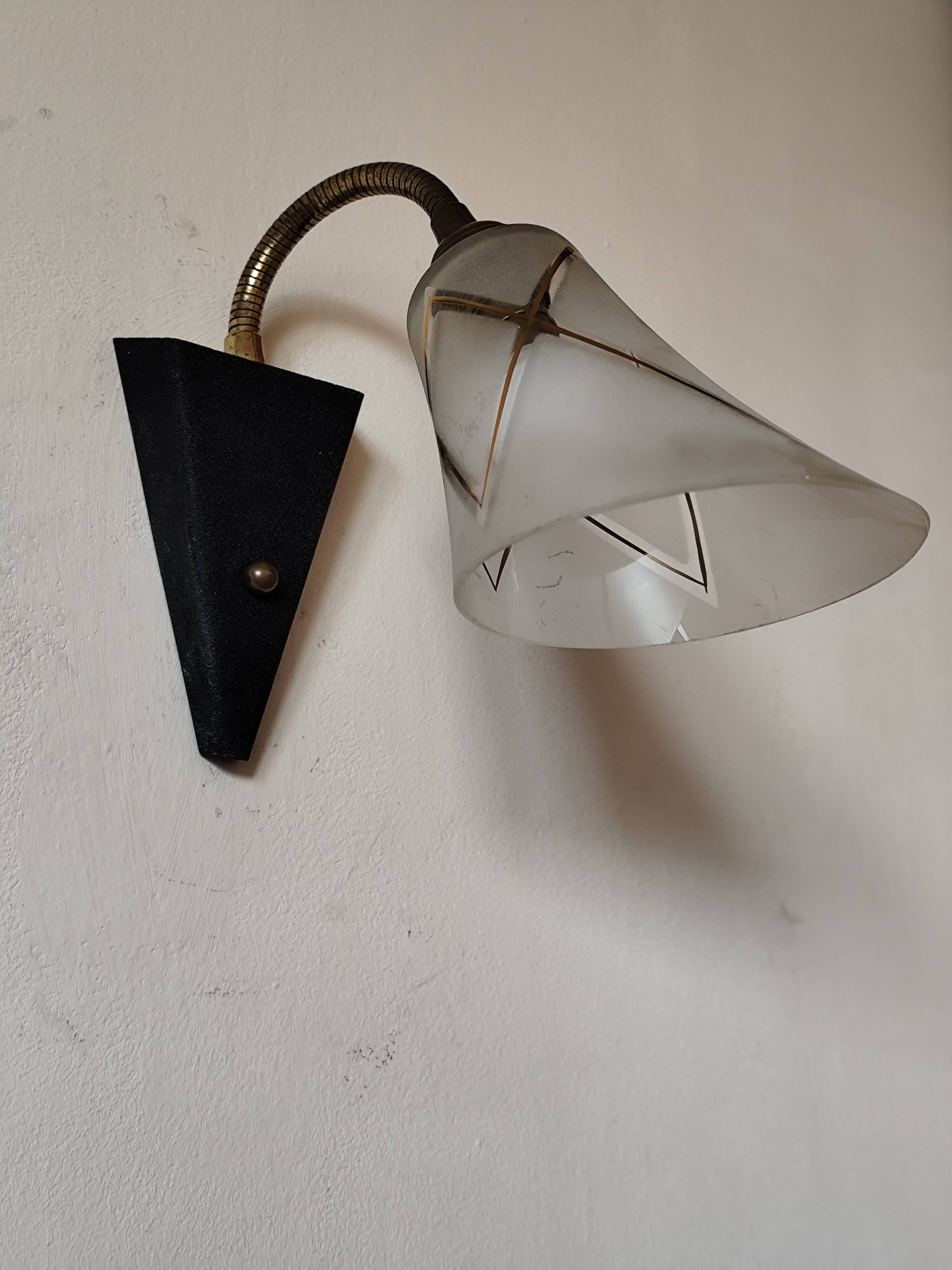 1950s wall lamp, metal, flexible brass stem and opaque shade.