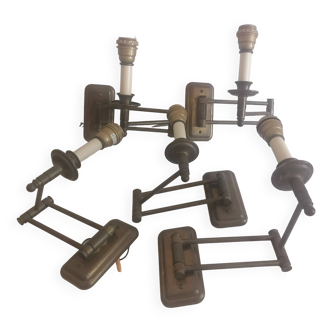 Suite de 5 appliques articulées en laiton.