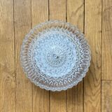 Large wall-mounted ceiling light with transparent glass.