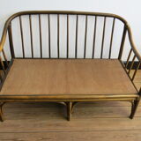 Two-seater rattan sofa with natural tones