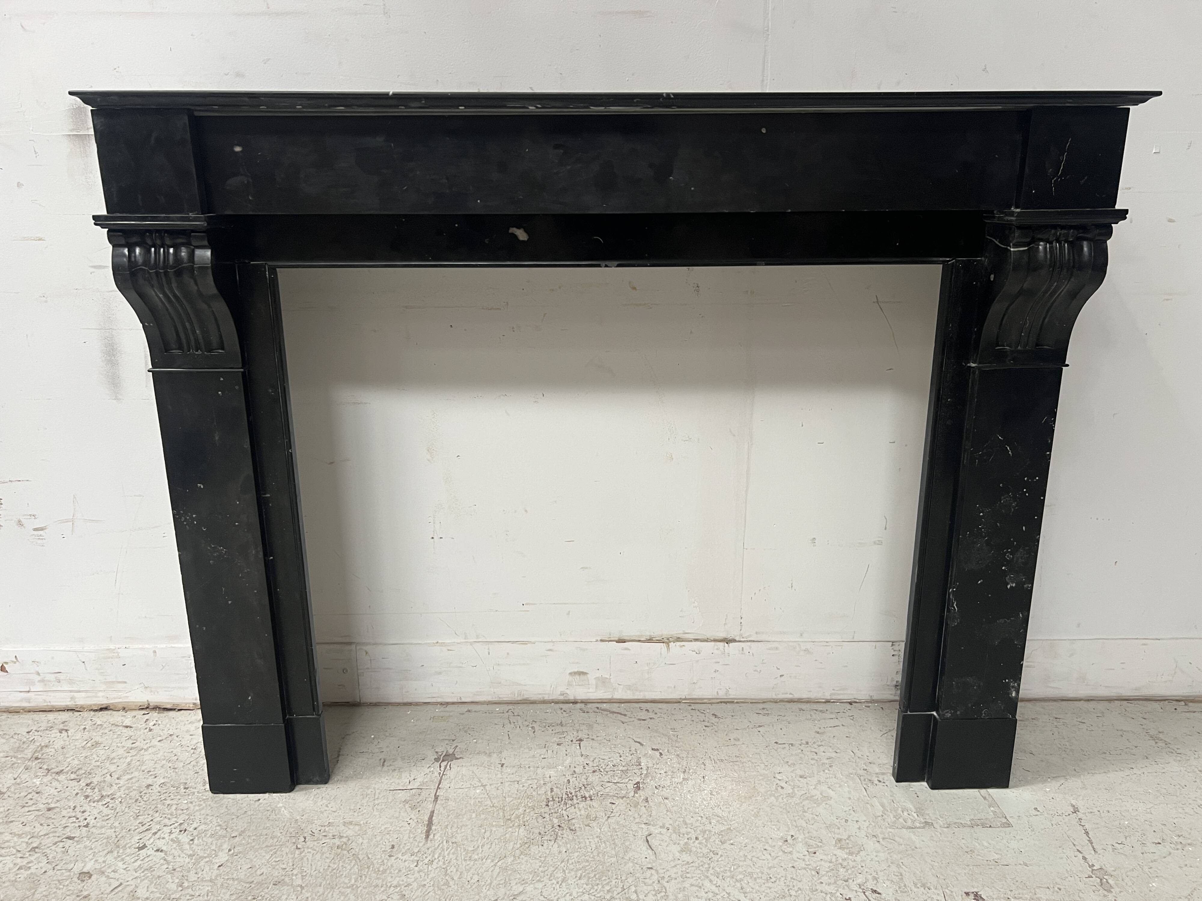 Napoleon III period fireplace with a black marble corbel. 19th century.