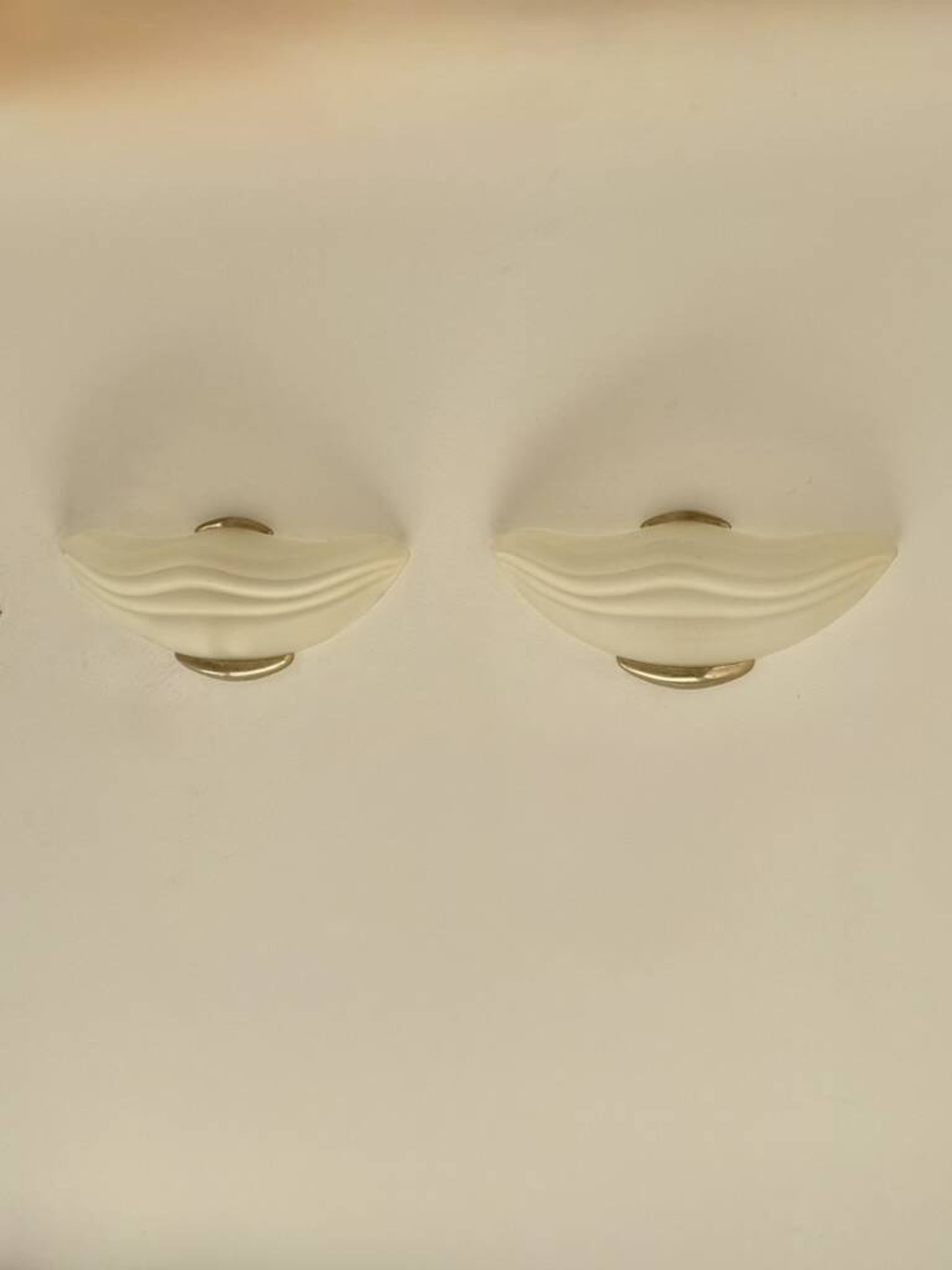 Pair of vintage wall lights in brass and frosted glass, Italy, 1970.