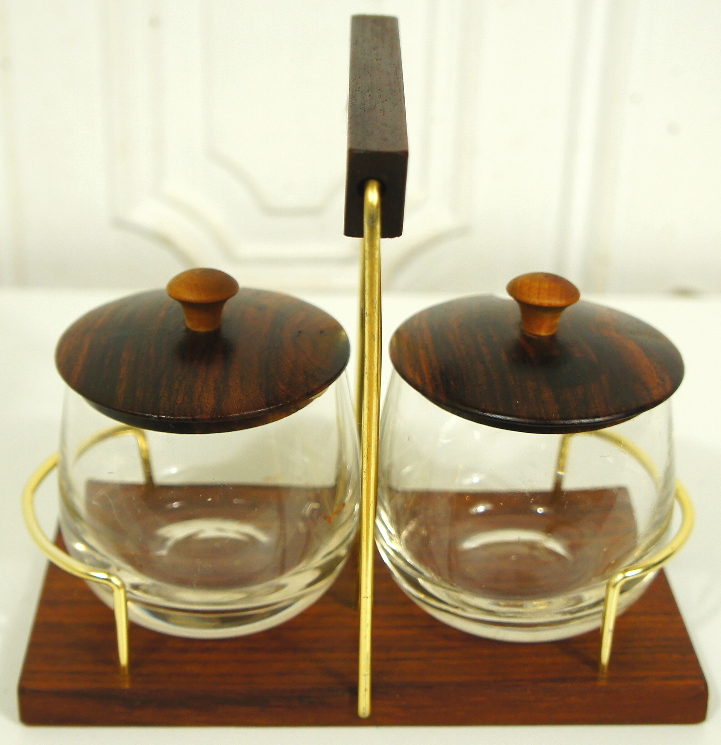 Scandinavian condiment servant made of olive wood