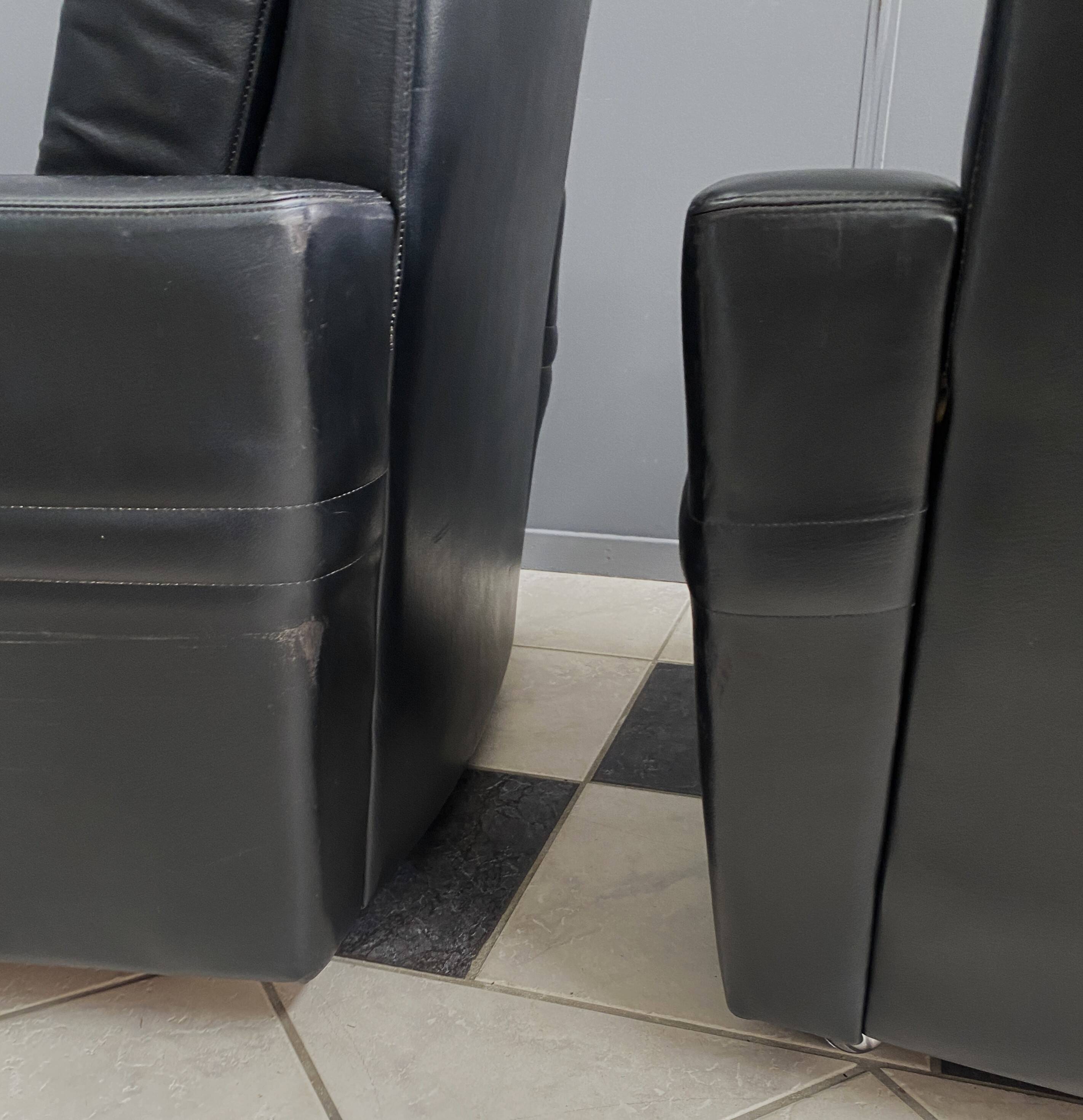 2 Black leather arm chairs 1960s on wheels